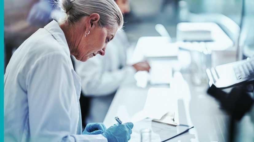 scientists in lab with checklist